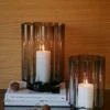 Anya Hurricane Candle Holder in grey mouthblown glass with sculptural curved detailing