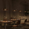 bassa-pendant-light-champagne-lifestyle Bassa Pendant Light – Champagne with rounded champagne glass shade and slim black suspension.