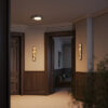 Clarett marble-effect and brass LED wall light with slim vertical design.