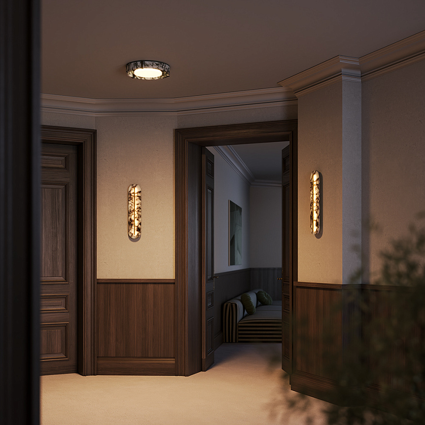 Clarett marble-effect and brass LED wall light with slim vertical design.