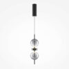 Double Moon pendant light with two clear glass spheres, slim black frame and contemporary design.