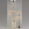 Double Moon pendant light with two clear glass spheres, slim black frame and contemporary design.