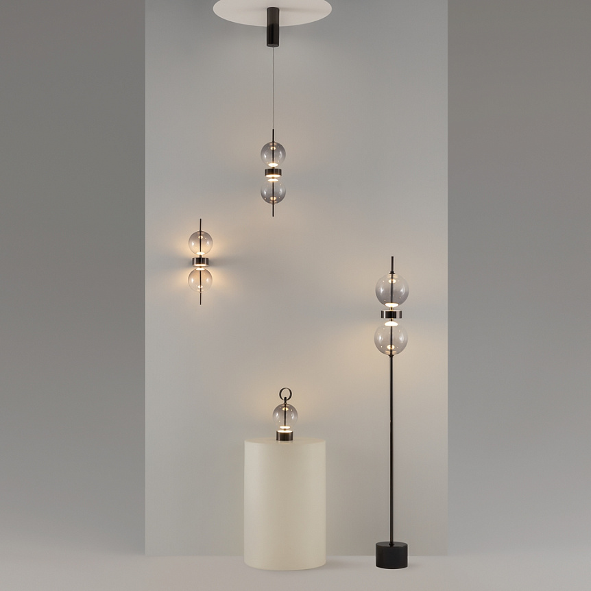 Double Moon pendant light with two clear glass spheres, slim black frame and contemporary design.