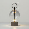 double-moon-rechargeable-table-lamp-black-lit Double Moon rechargeable table lamp with glass shade, black metal frame and contemporary sculptural design.