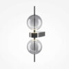 Double Moon black wall light with clear glass shade and contemporary metal detailing.