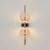 Double Moon black wall light with clear glass shade and contemporary metal detailing.
