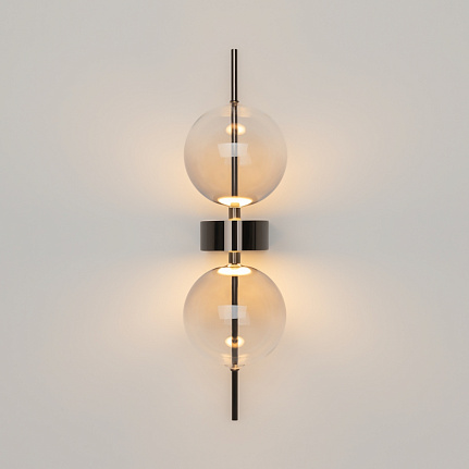 Double Moon black wall light with clear glass shade and contemporary metal detailing.