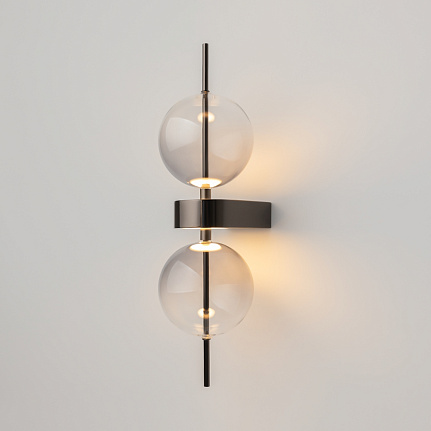 Double Moon black wall light with clear glass shade and contemporary metal detailing.