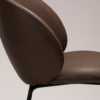 Era Chair in Major Brown faux leather with a rounded upholstered back, padded seat and slim black legs.