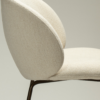 Era Chair in Simply Beige upholstery with rounded backrest, curved seat and slim Antique Brass legs.