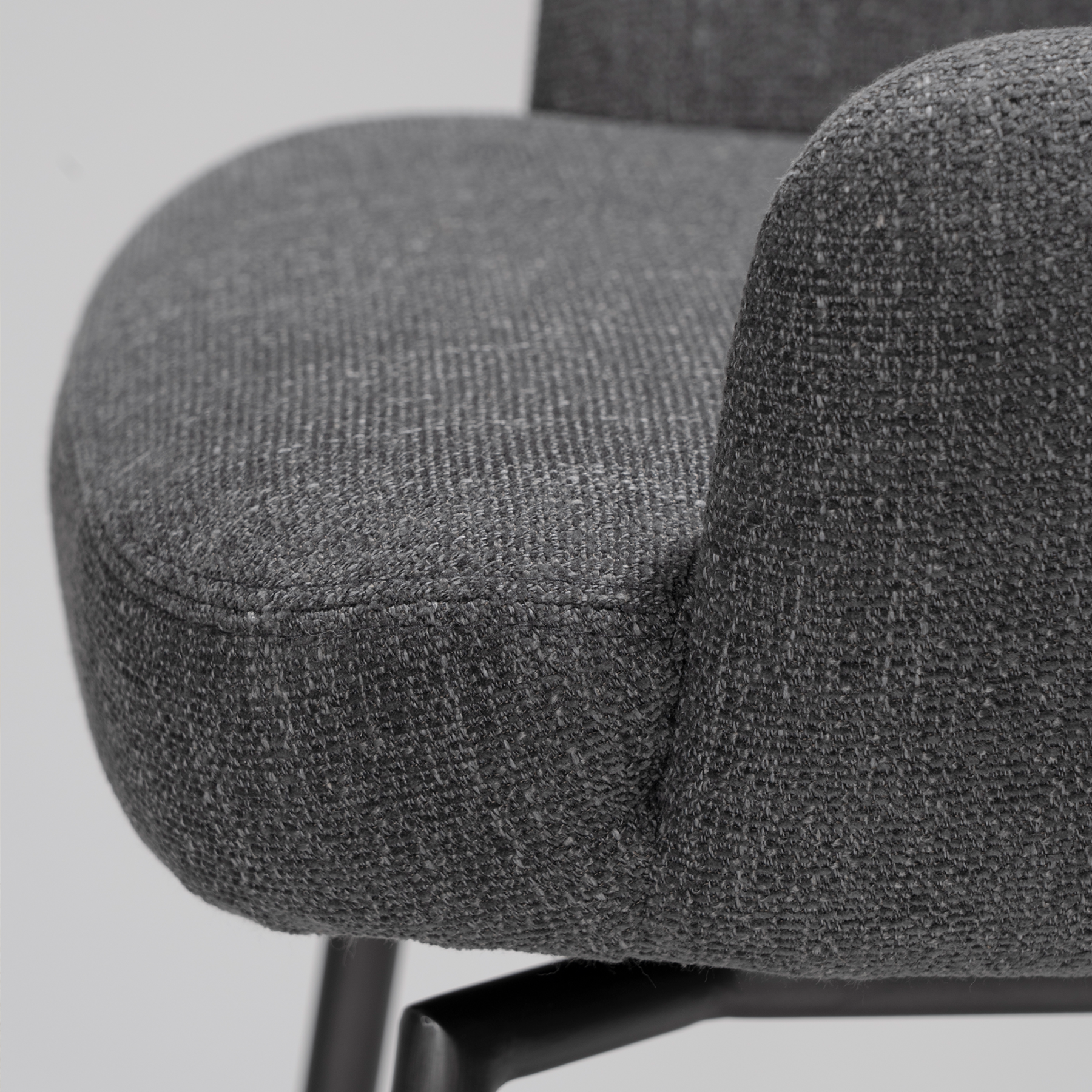 Ethos Swivel Counterstool in Slate Grey upholstery with curved armrests, integrated footrest and Antique Pewter legs.