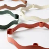 halo-candle-holder-caramel-brown-collectionjpg Halo candle holder in caramel brown powder-coated iron with sculptural wave-shaped design