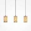 maris-3-light-linear-pendant-black-bub Maris 3 light linear pendant with black frame and three textured warm-toned shades.