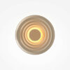 nami-led-wall-light-champagne Nami champagne circular LED wall light with sculptural wave design and warm ambient glow.