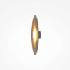 nami-led-wall-light-warm-grey-side Nami warm grey circular LED wall light with layered wave design and soft 2700K ambient glow.