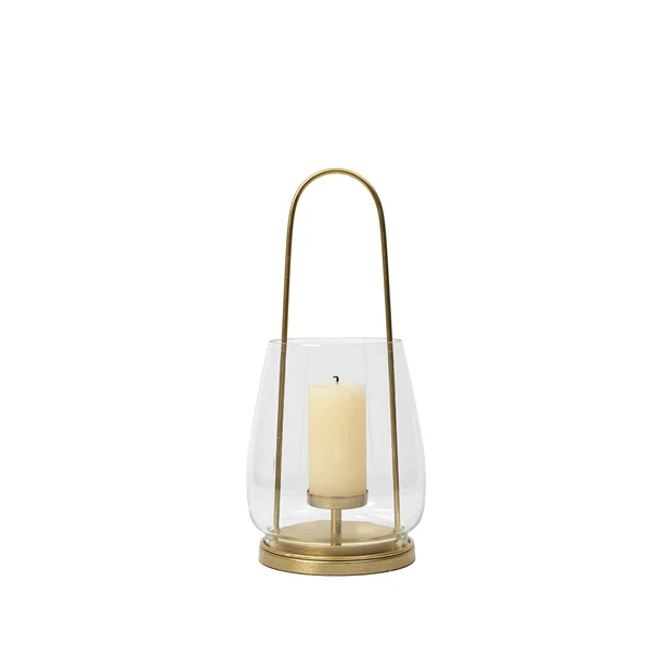 nilo-lantern-brass-metal-glass-with-candle Nilo Lantern in brass-finish metal and clear glass with a tall contemporary design