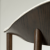ravish-armchair-simply-beige-boucle-mocca-stained-ash-veneer-close-up Ravish Armchair in Simply Beige bouclé with curved upholstered back, mocca stained ash veneer and matching timber legs.