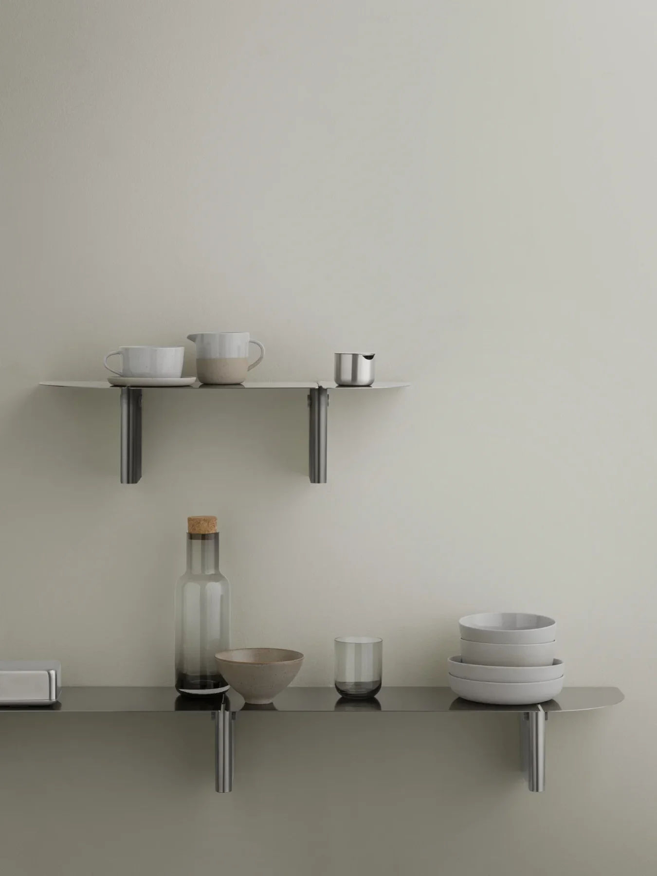 Fuumi Water Carafe in smoke on a shelf.