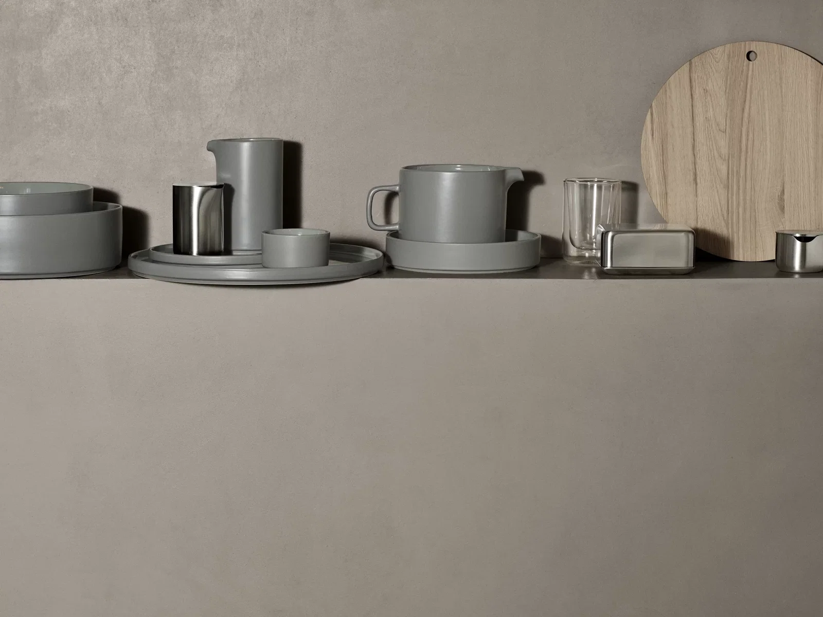 The Nero insulated coffee glass on a shelf
