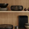 Black Lito bowls on a timber shelf