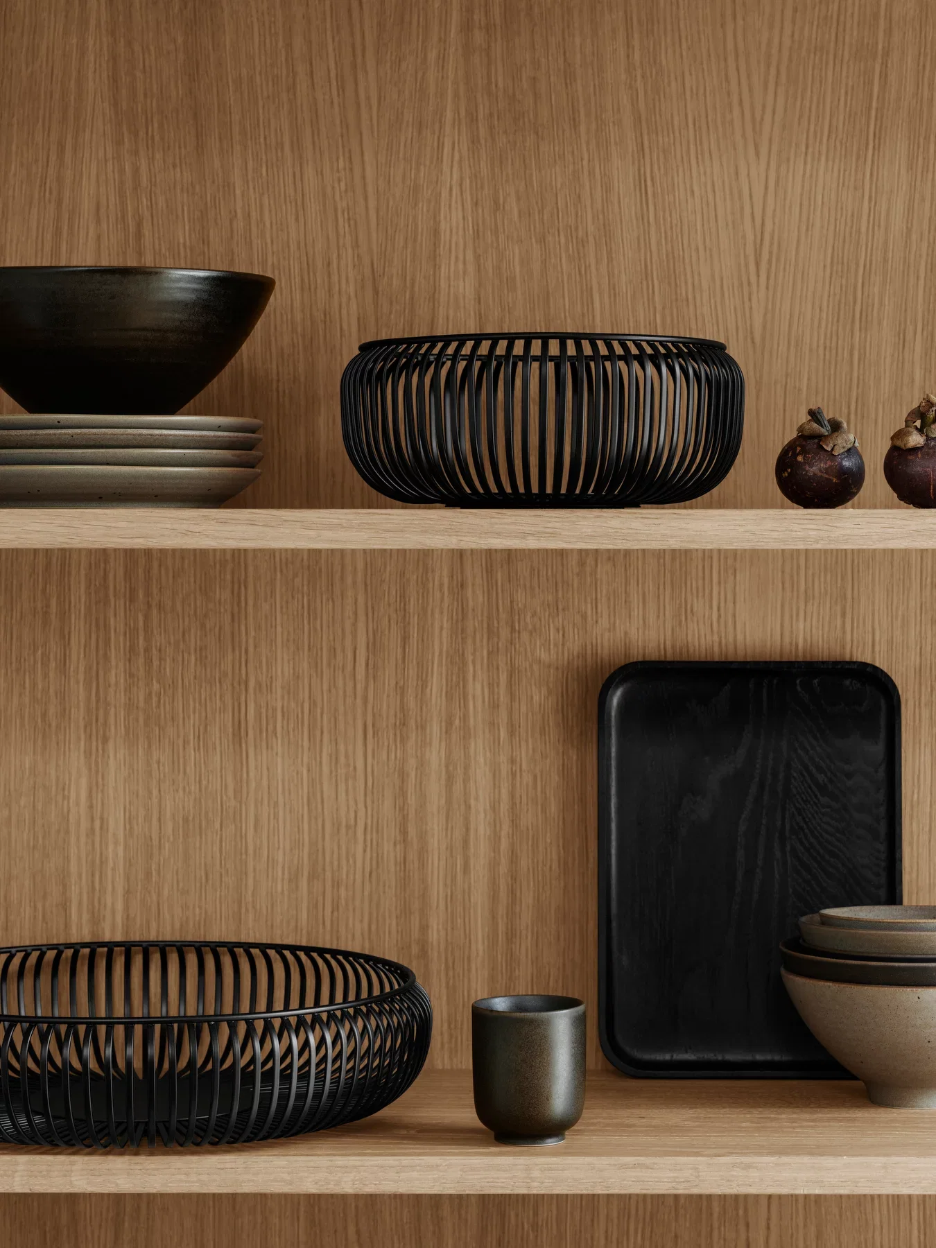 Black Lito bowls on a timber shelf