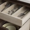 Stainless steel salad servers in oak cutlery drawer