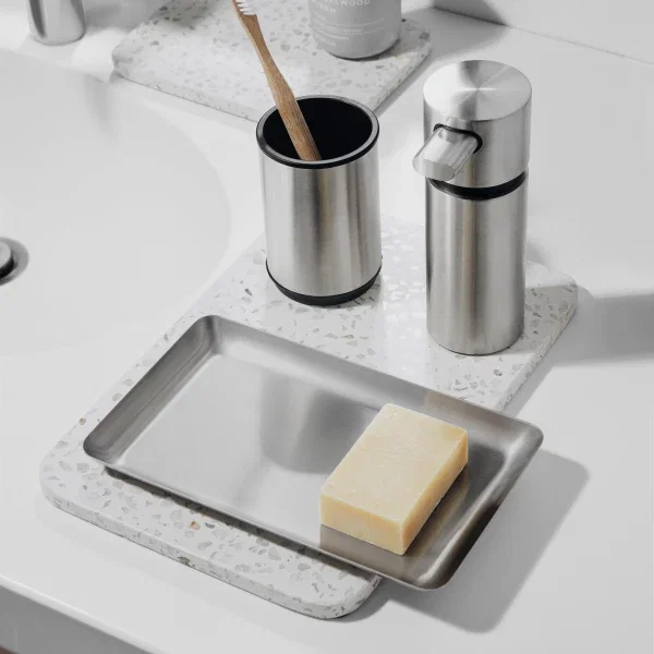 A stainlees steel tray for holding soap