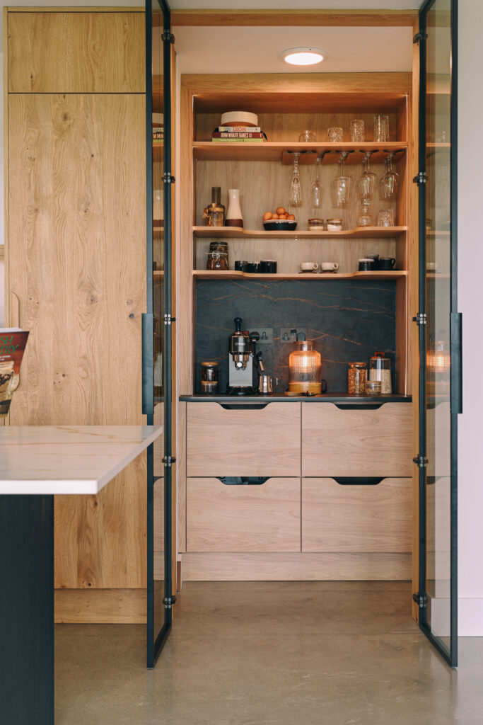 View of the pantry with crittal-style doors open